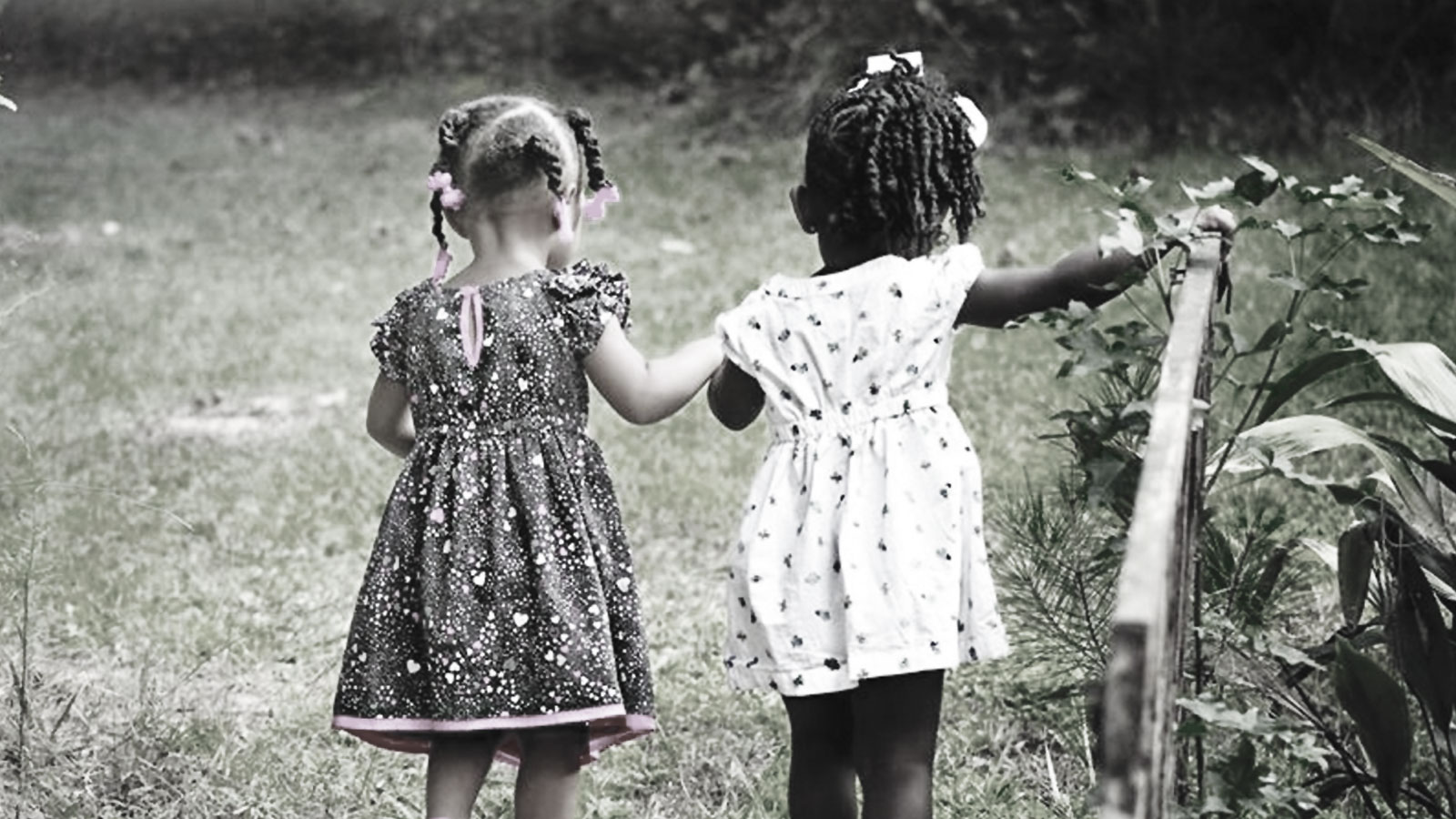 Supporting children's mental health. A photo of Two young girls holding hands