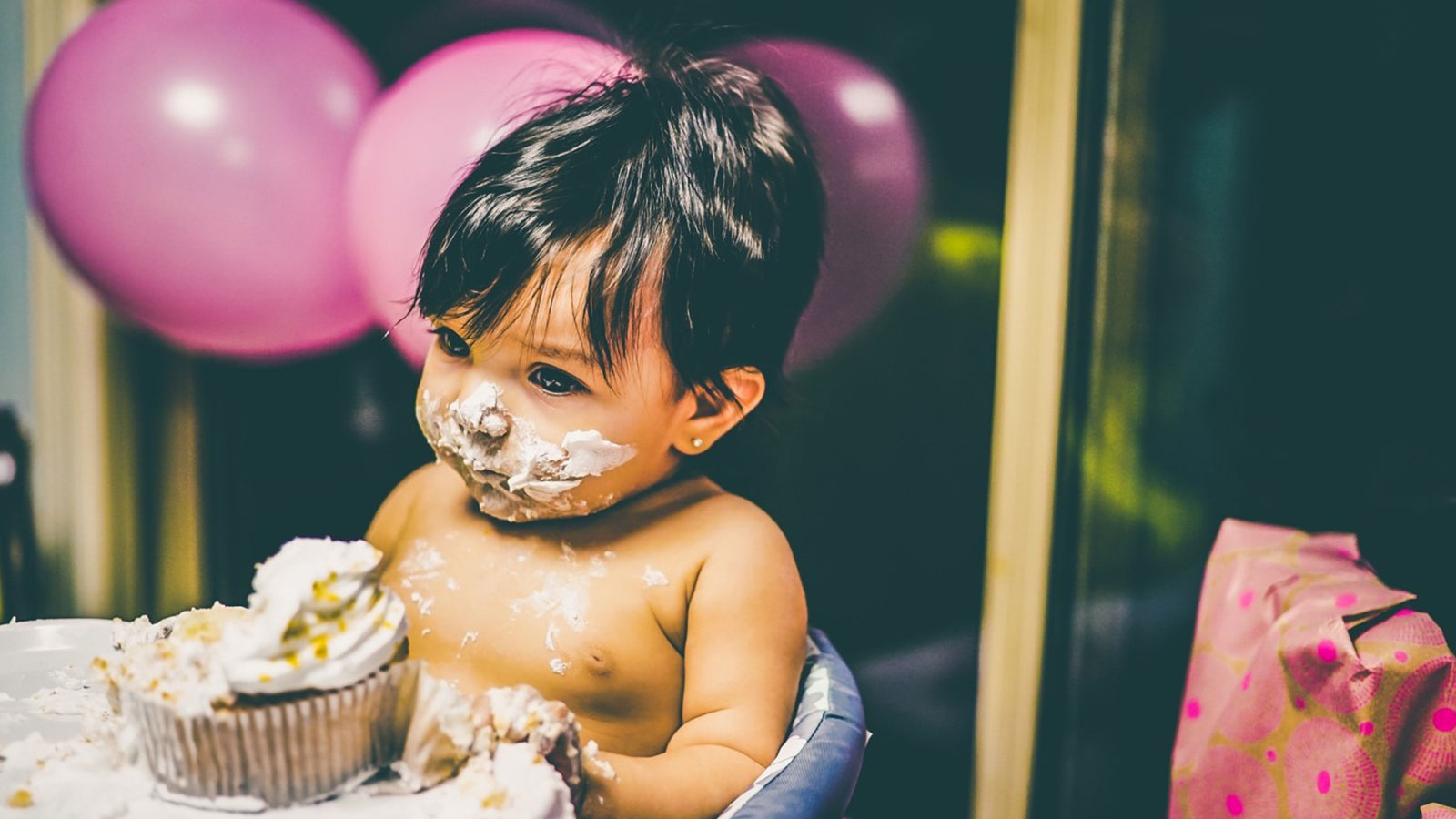 Childhood obesity Thought Piece. A photo of a baby eating a cake.