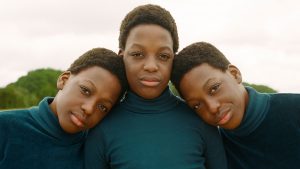 COVID children Thought Piece featured image of a photo of triplets posing to the camera